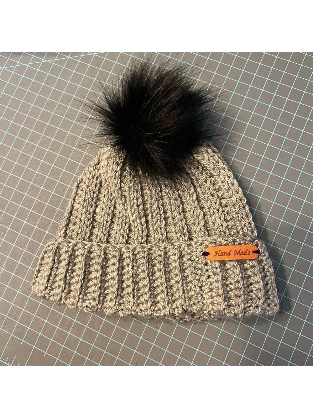 Handmade crocheted beanie hat. Toddler size. Gray with black Pom Pom.